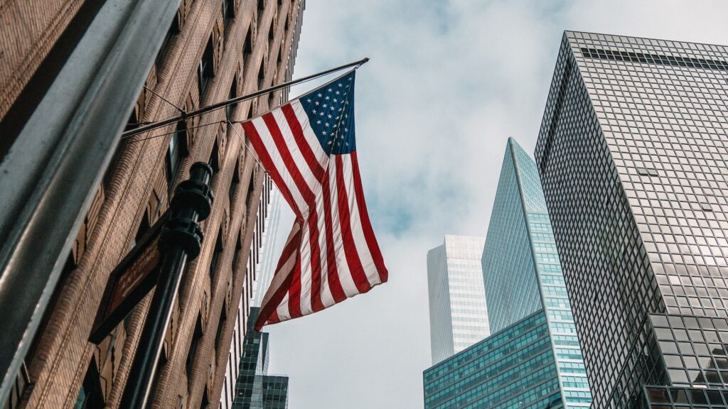 Photograph of the flag of the United States waving in the wind in New York City.